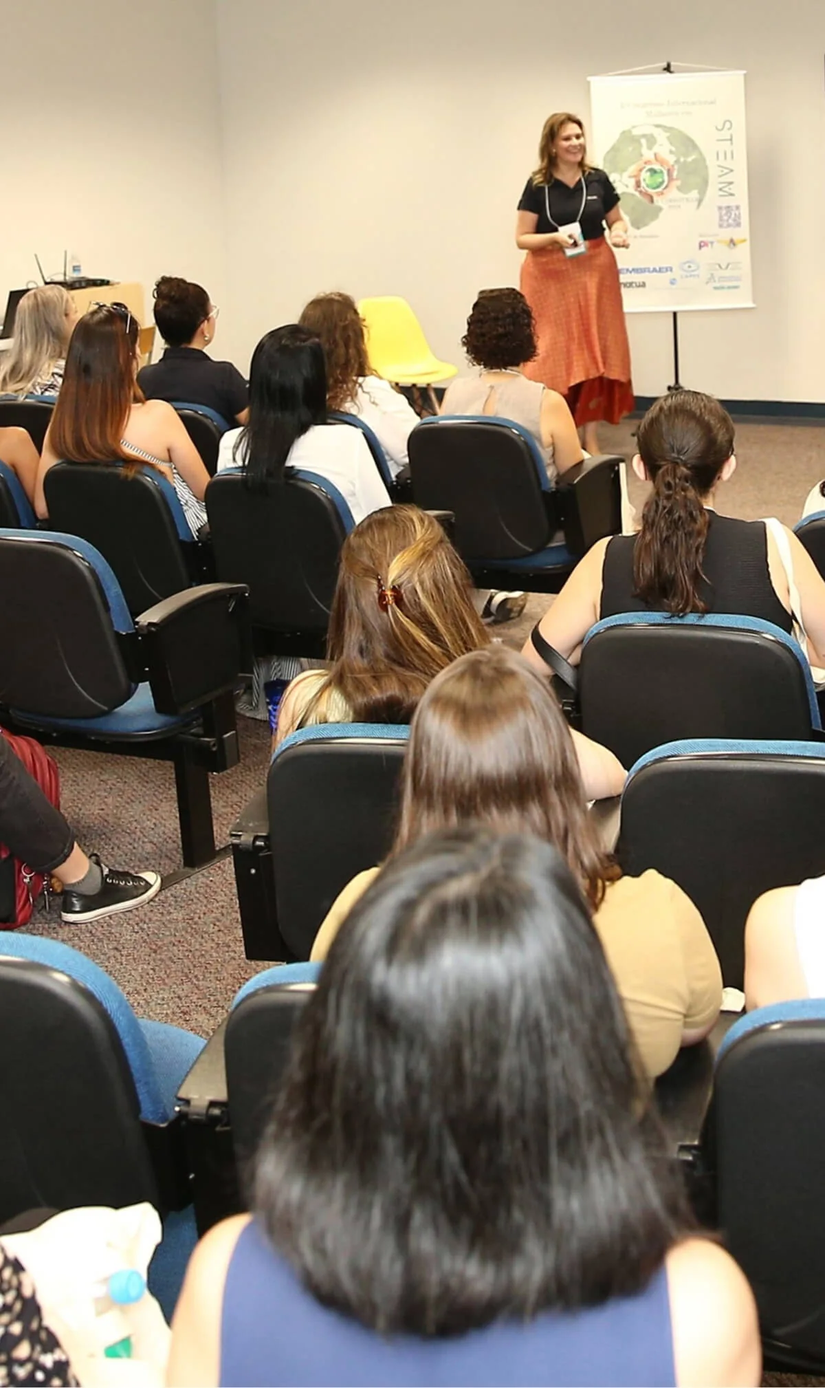 A speaker addresses the audience