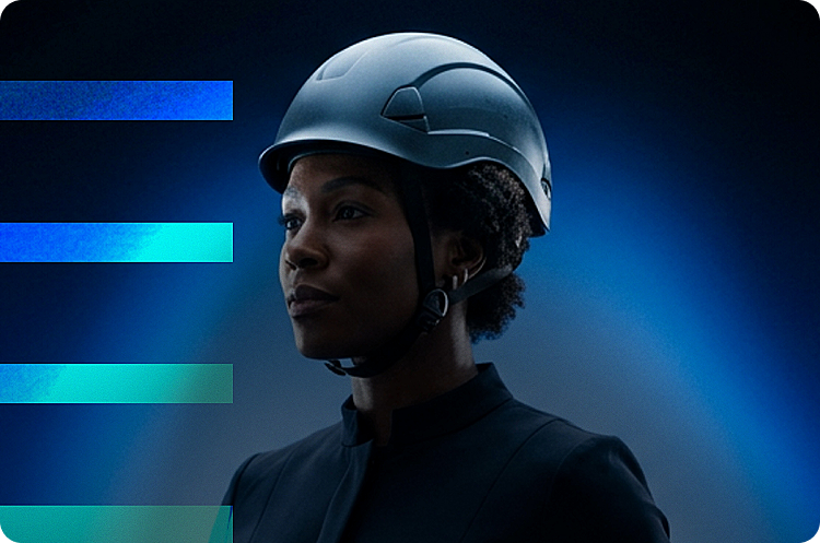 Woman engineer wearing a helmet, looking ahead
